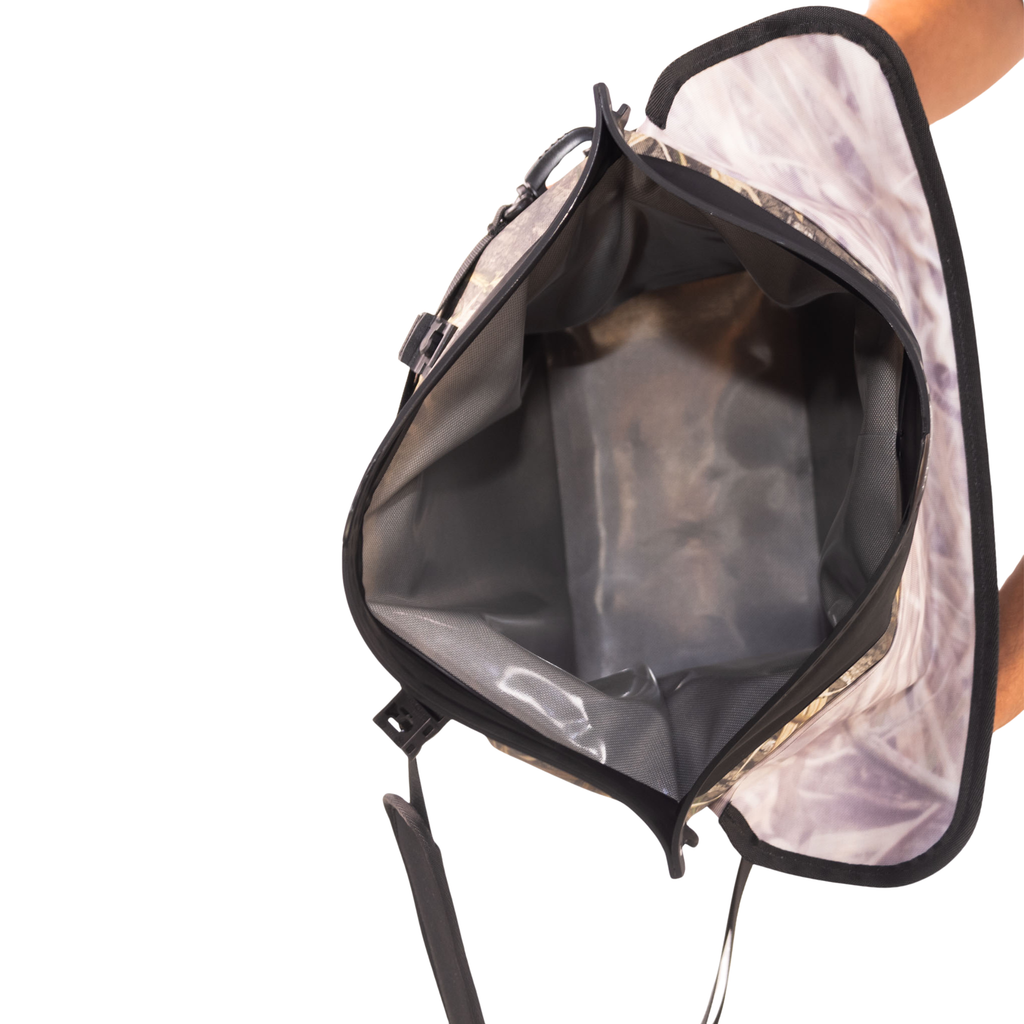Camo hunting bag with waterproof interior and mesh pockets for outdoor gear storage