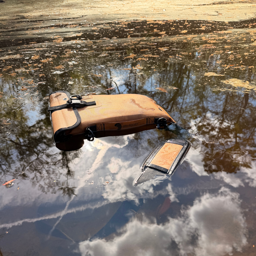 Waterproof dry pocket floating in stream, ideal for hunting and outdoor gear protection