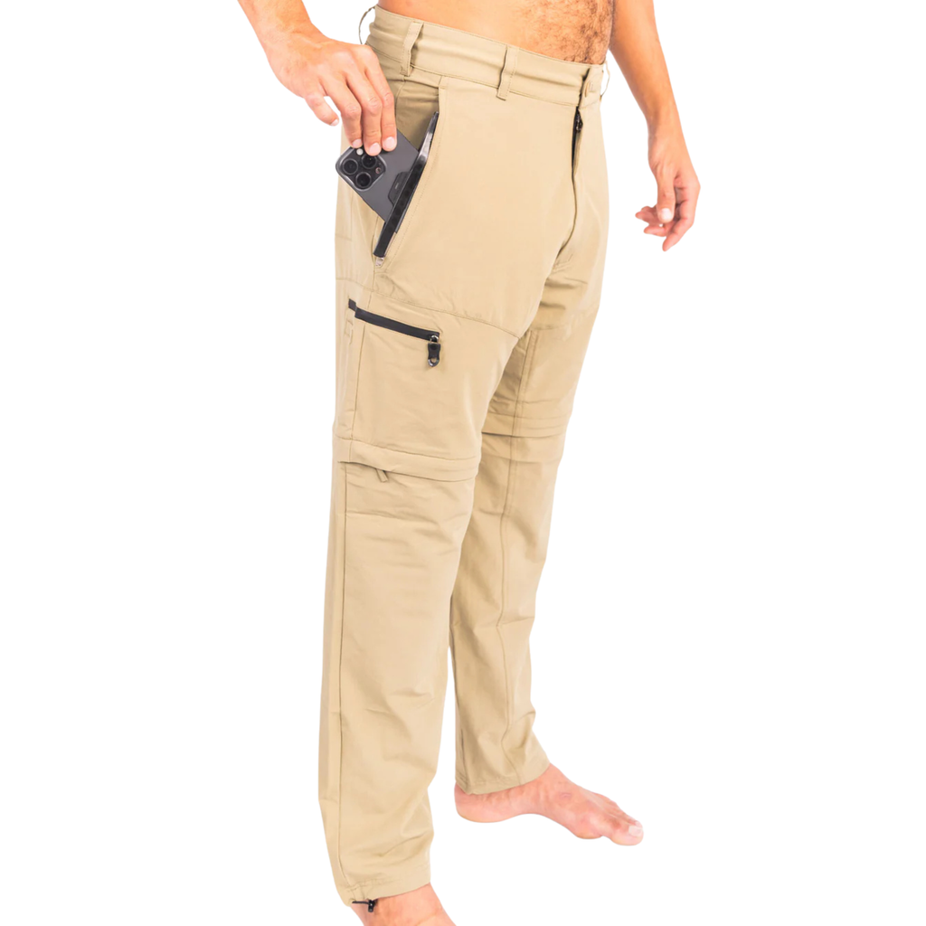 Tan hunting pants with zippered pockets, phone storage, and adjustable cuffs for outdoor adventures