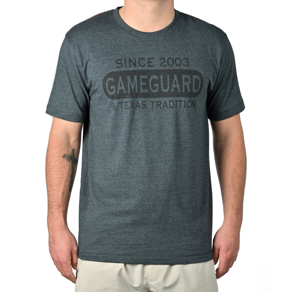 Dark gray GameGuard t-shirt with 'Since 2003 A Texas Tradition' text, hunting apparel for outdoorsmen