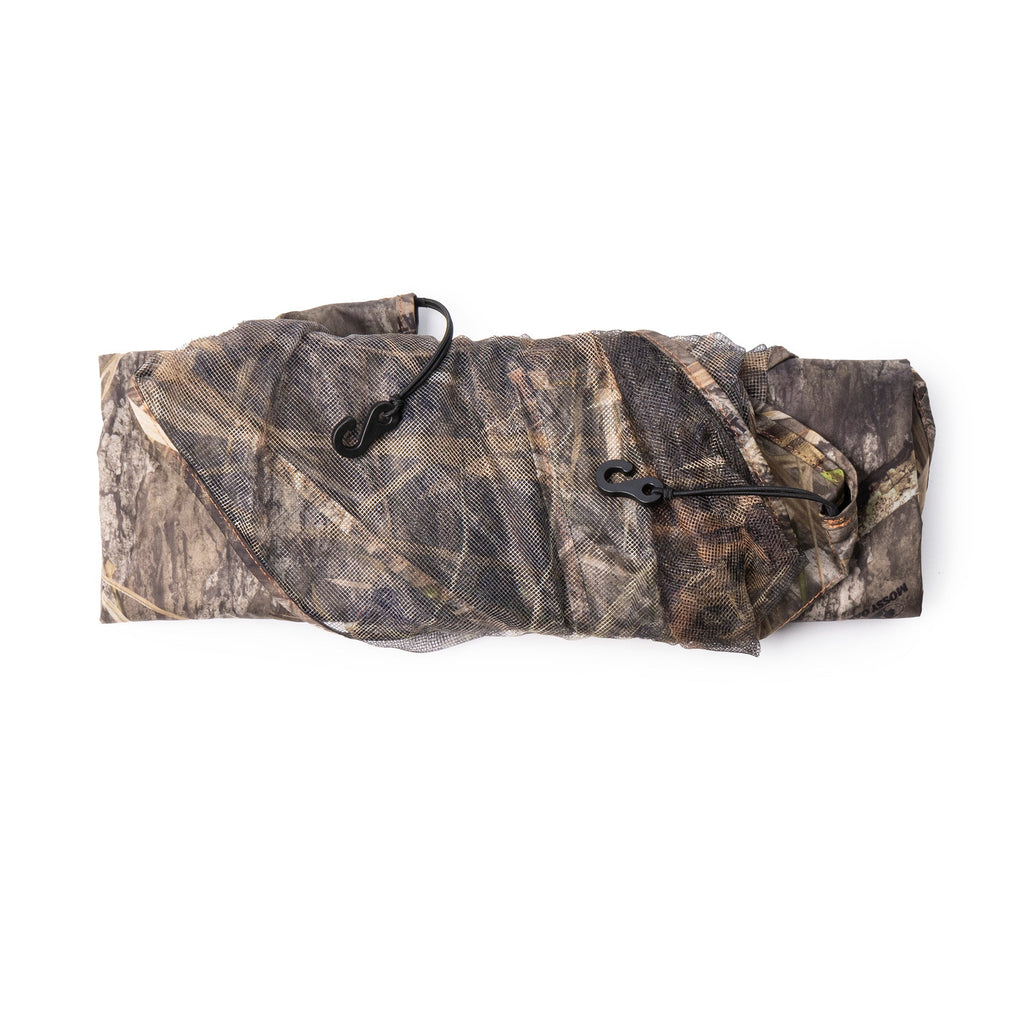 Mossy Oak camo hunting blind netting with mesh and hooks for concealment in the field
