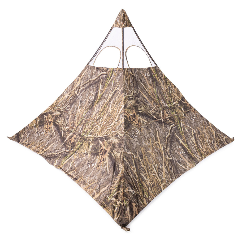Camo hunting blind with mesh windows for concealment in marsh or field environments