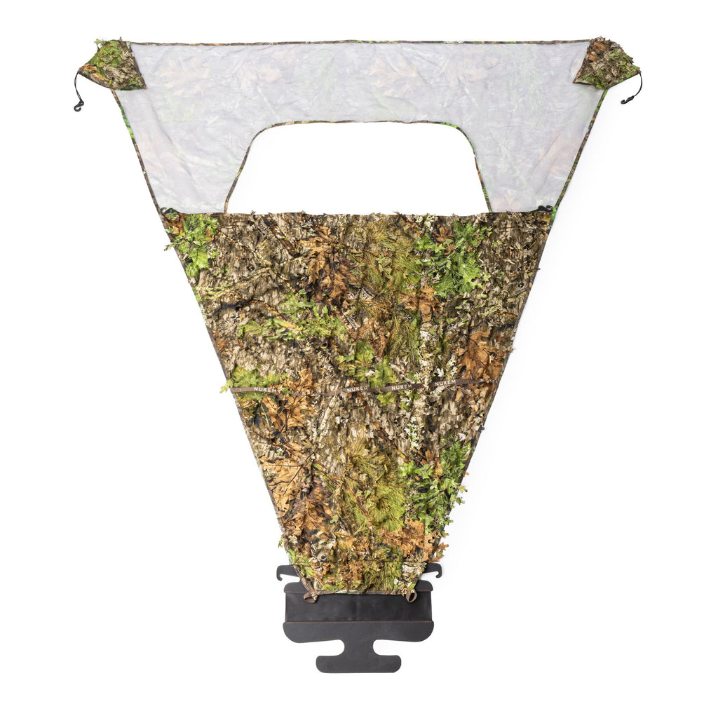 Camo hunting blind with leafy woodland pattern and mesh viewing window for tree stand concealment