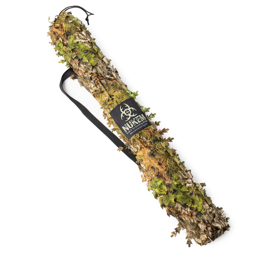 NUKEM Grab & Go hunting blind with leafy camouflage pattern for outdoor concealment