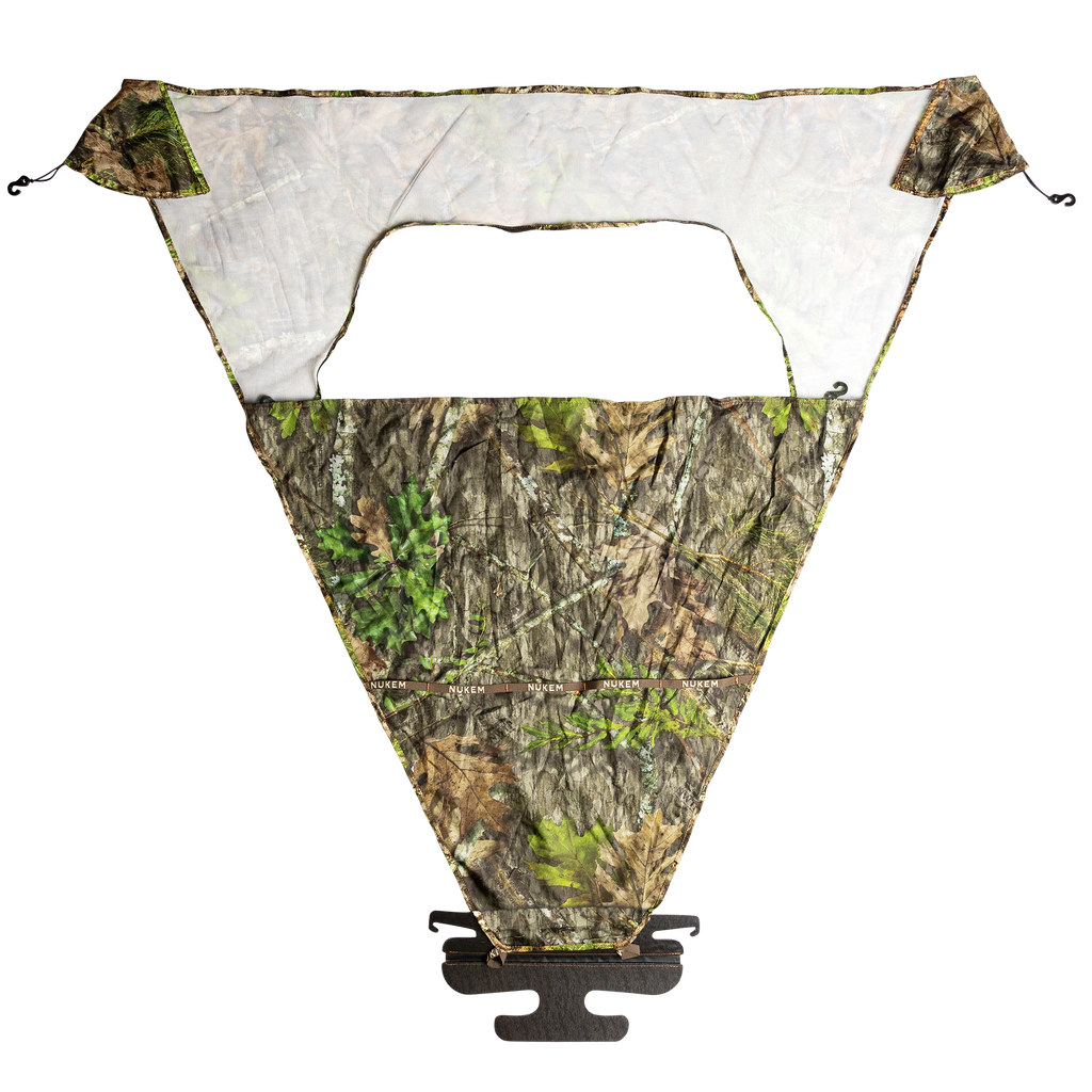 Nukem camo hunting blind window with mesh panel and tree bark pattern for concealment in woods