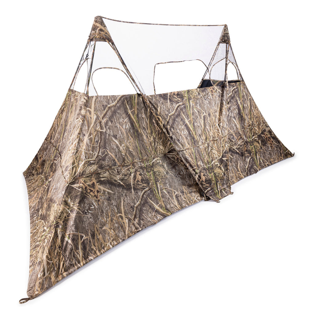 Camo hunting blind with mesh windows for concealment in marsh or field environments