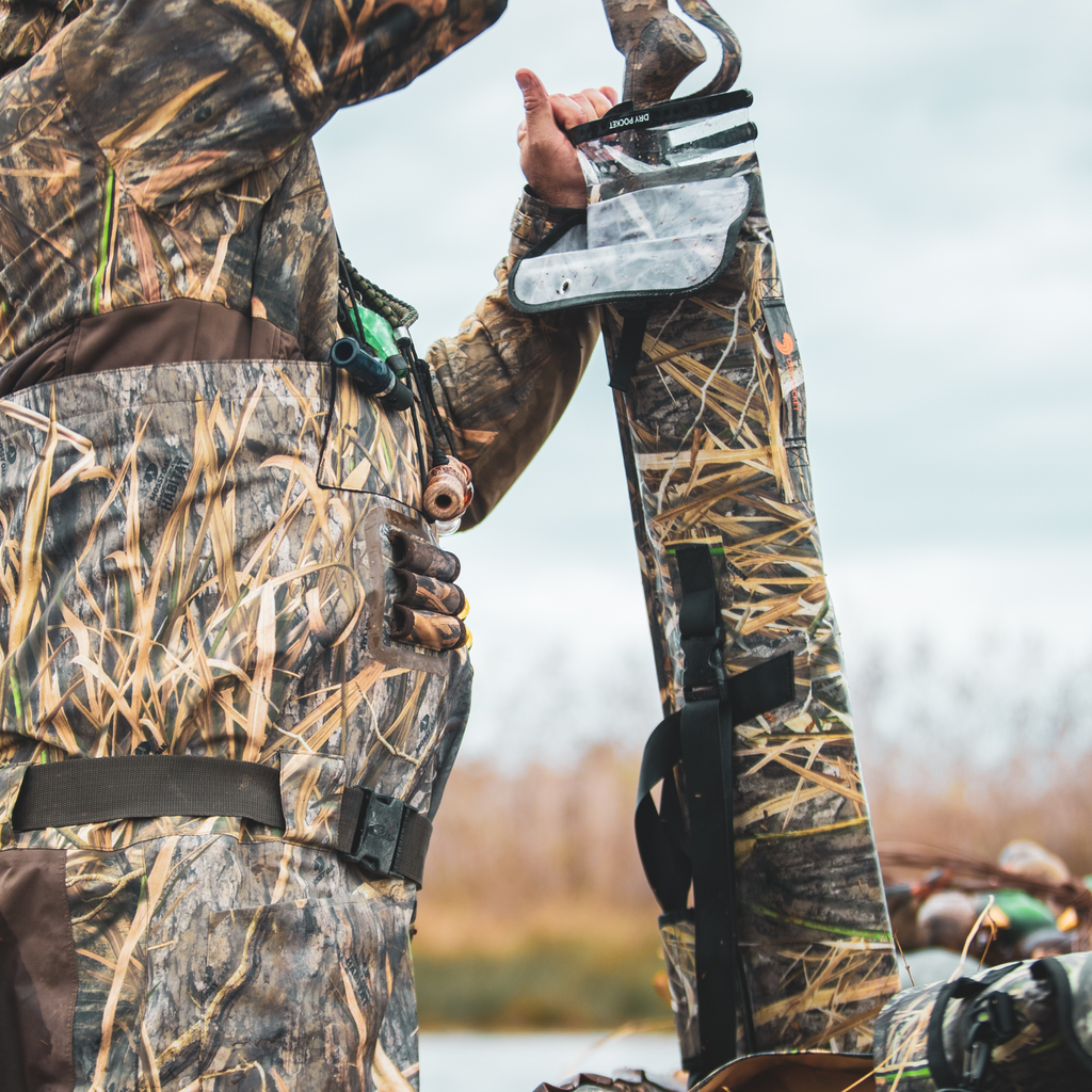 Mossy Oak camouflage waders with dry pocket, ideal for waterfowl hunting and wetland adventures