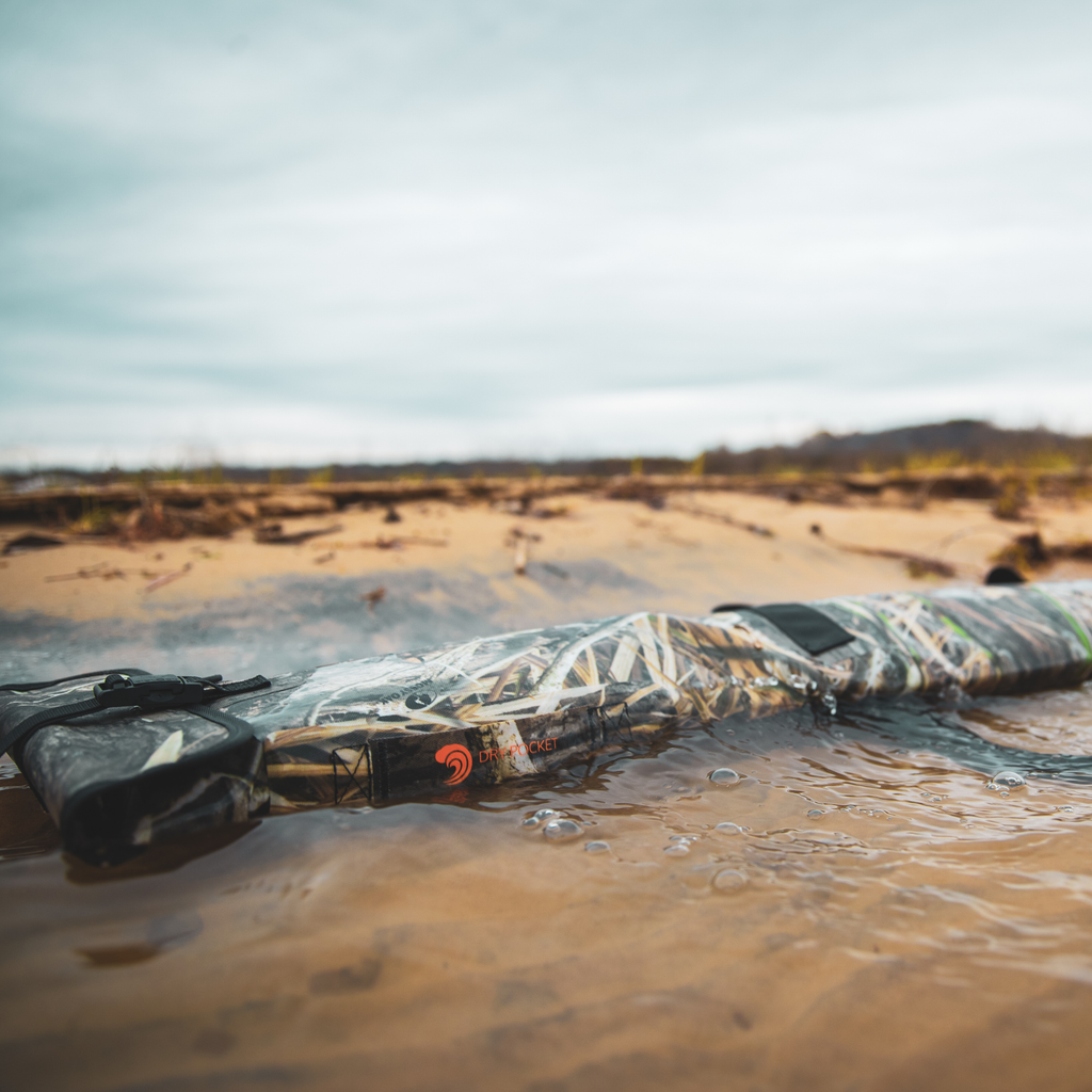 Camo dry pocket floating in water, waterproof hunting gear for wet outdoor adventures
