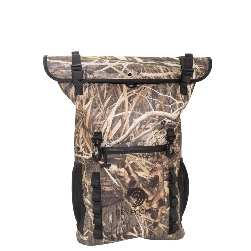 Mossy Oak camo dry bag with roll-top closure, side pockets, and D-ring attachments for hunting gear storage