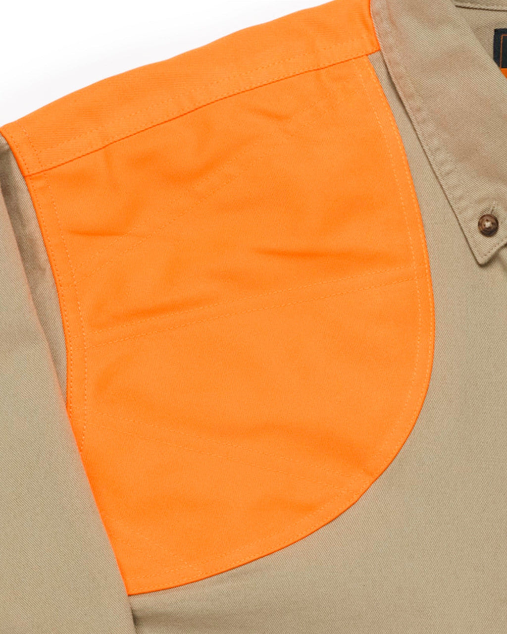 Close-up of the blaze orange double-reinforced shooting shoulder on the khaki field shirt