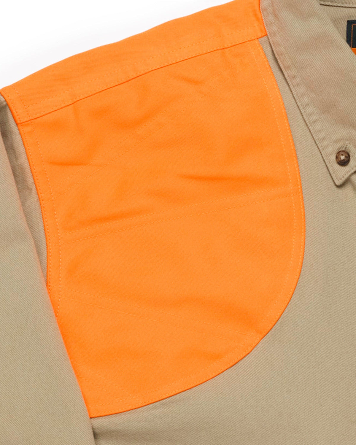 Close-up of the blaze orange double-reinforced shooting shoulder on the khaki field shirt