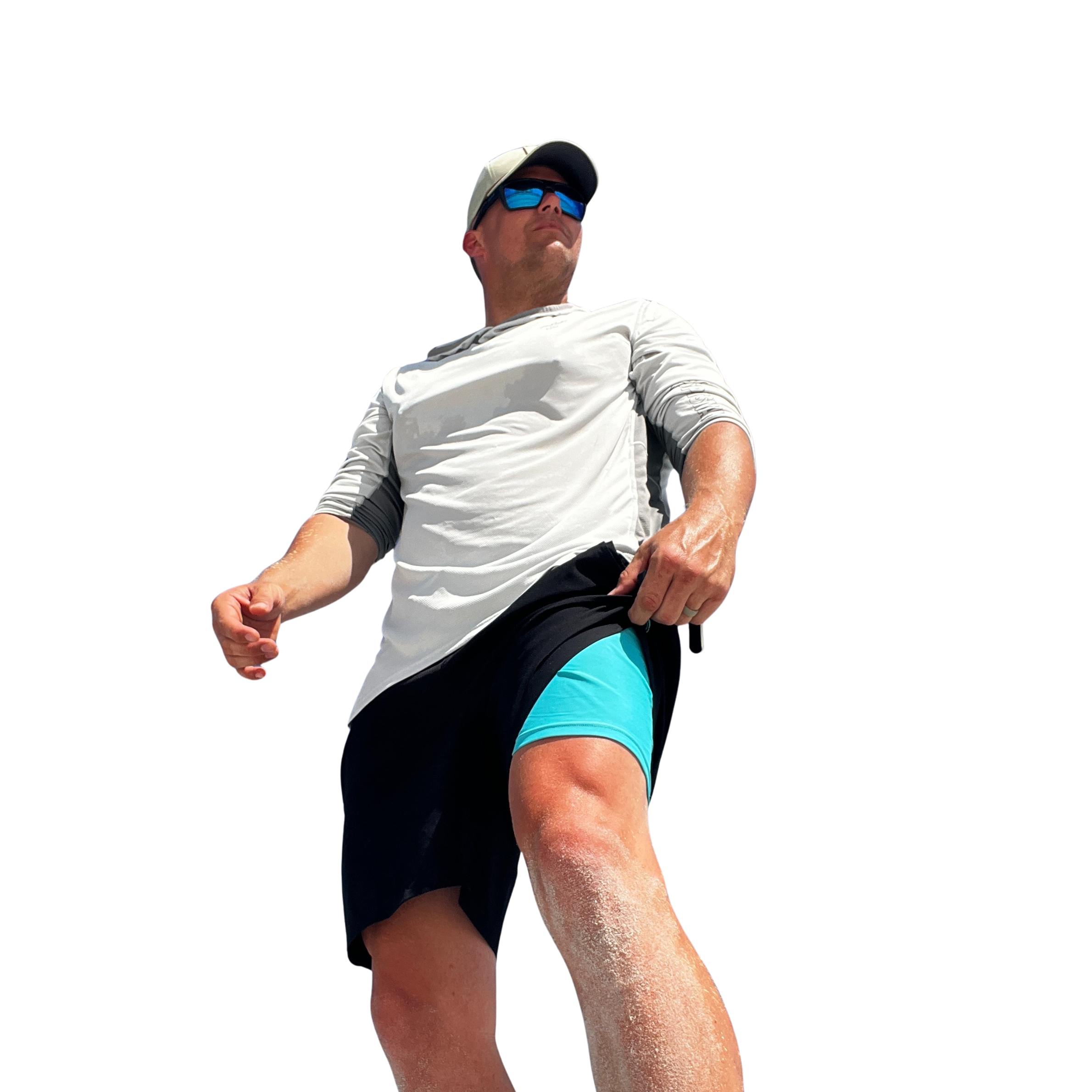 Man wearing white long-sleeve shirt, black shorts with teal lining, and sunglasses for outdoor activities