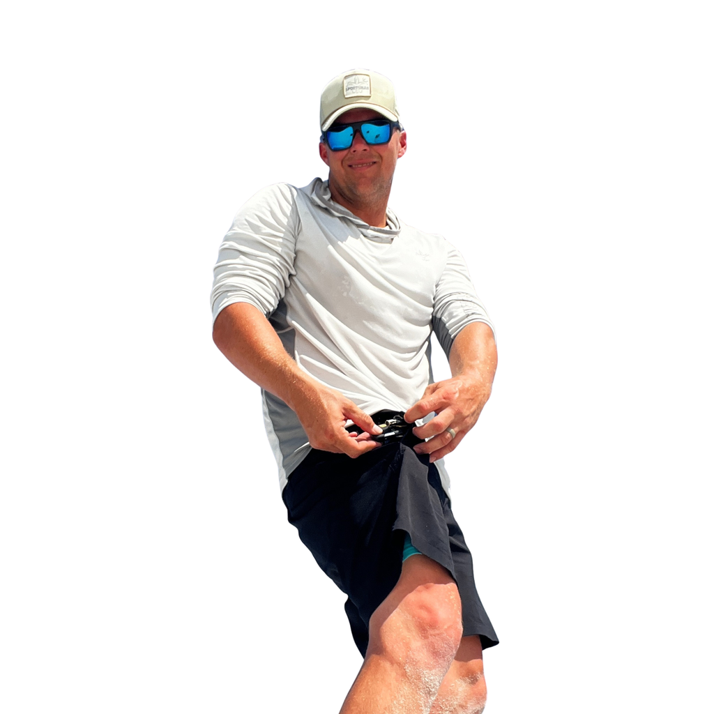 Man wearing gray long sleeve fishing shirt, blue mirrored sunglasses, and beige cap for outdoor sun protection