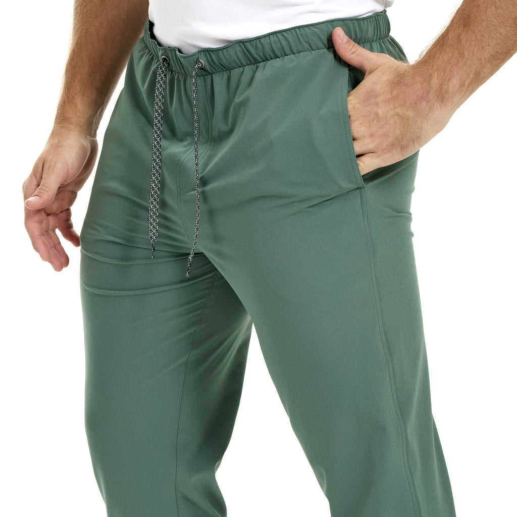 Men's olive green drawstring hunting pants with side pockets, lightweight outdoor wear for hiking and field use