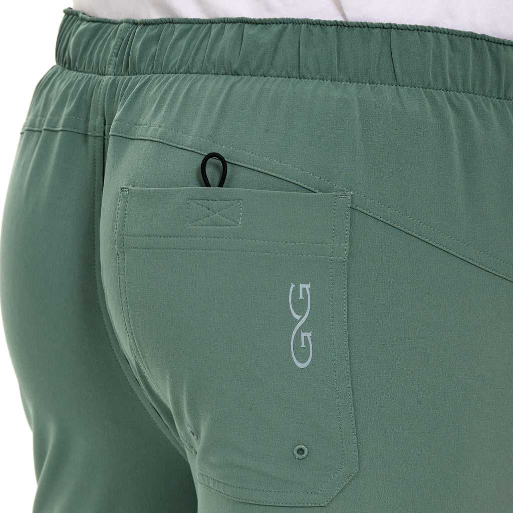 Olive green hunting pants with elastic waist, rear pocket, and gear loop for outdoor adventures