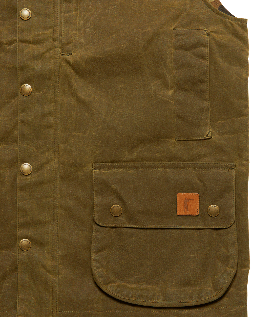 Front flap pocket with leather Arthur patch on the Olive Upland Vest