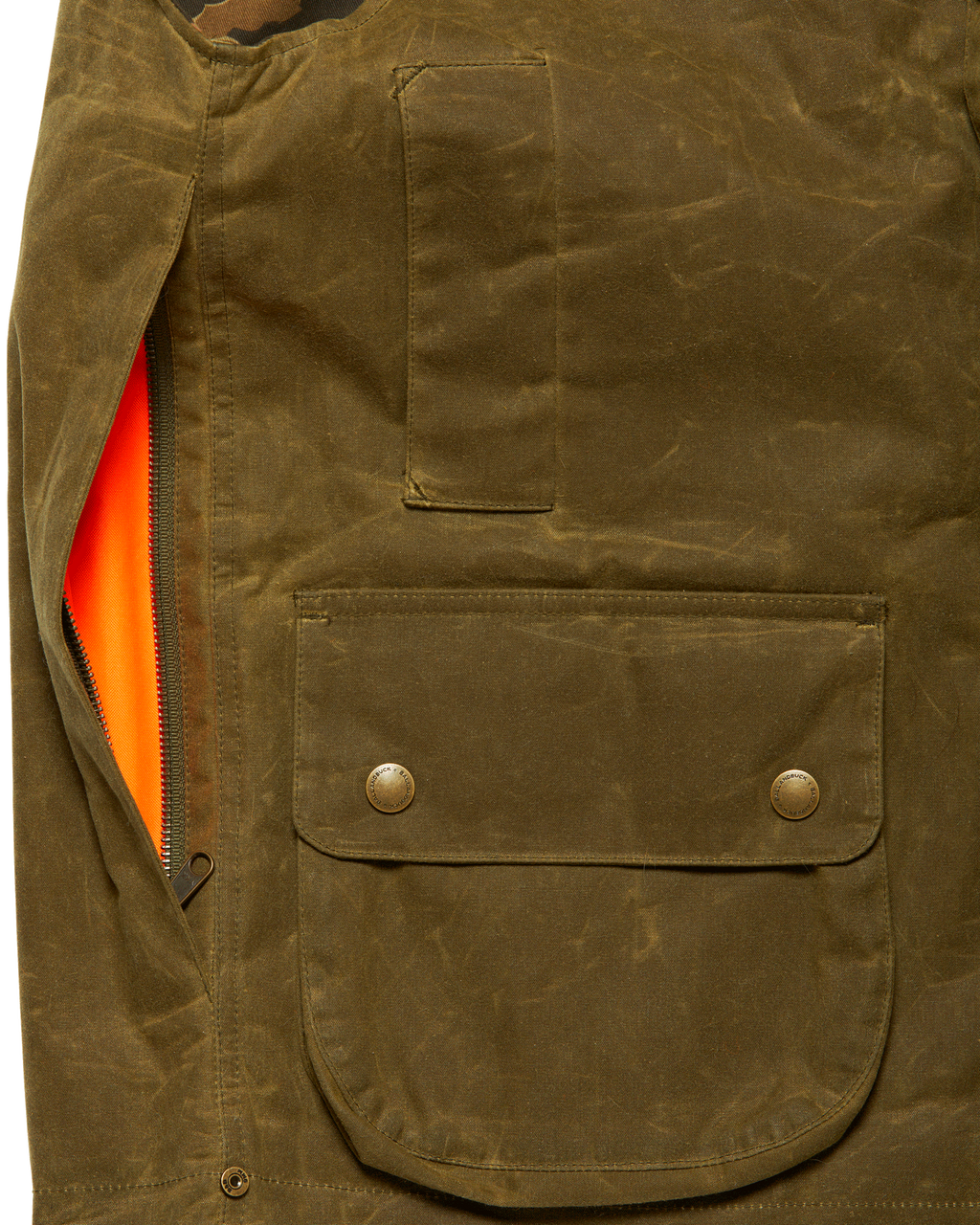 Side-access game pocket with blaze orange liner on the Olive Upland Vest