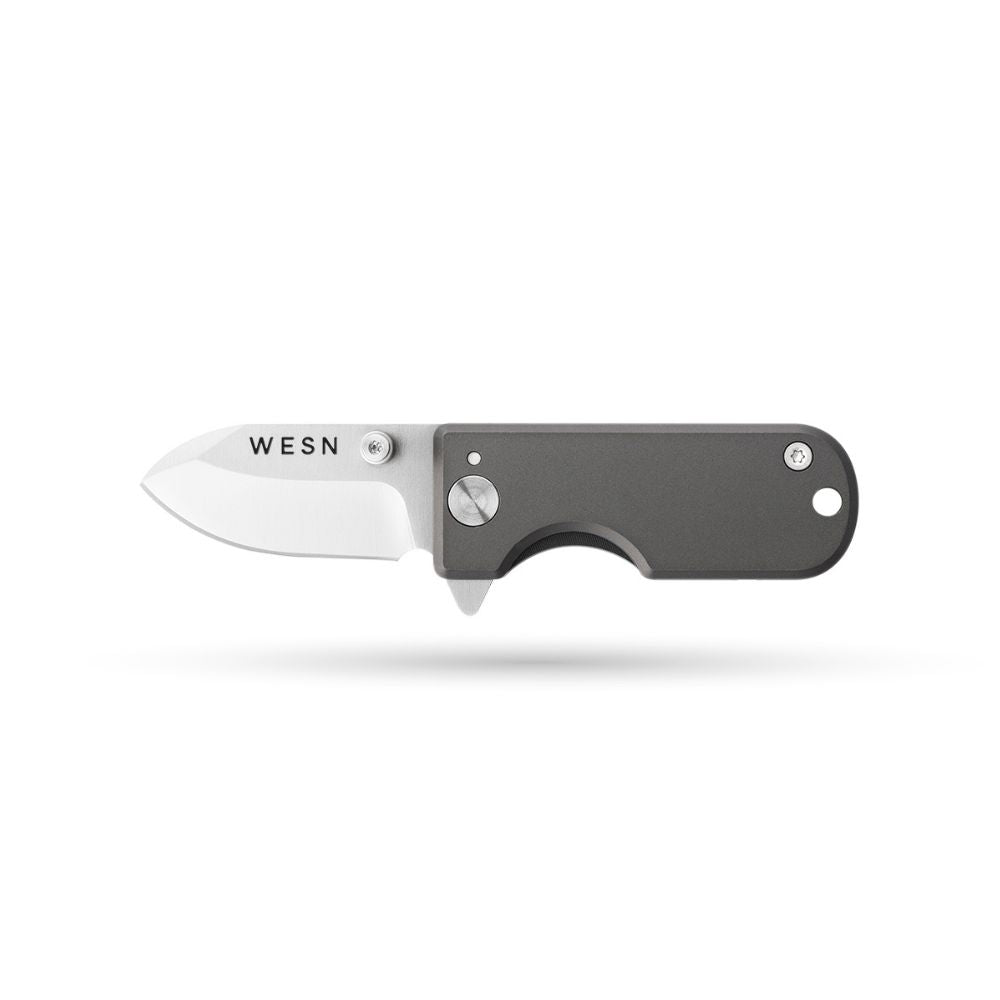 WESN Microblade keychain pocket knife with a bare titanium frame