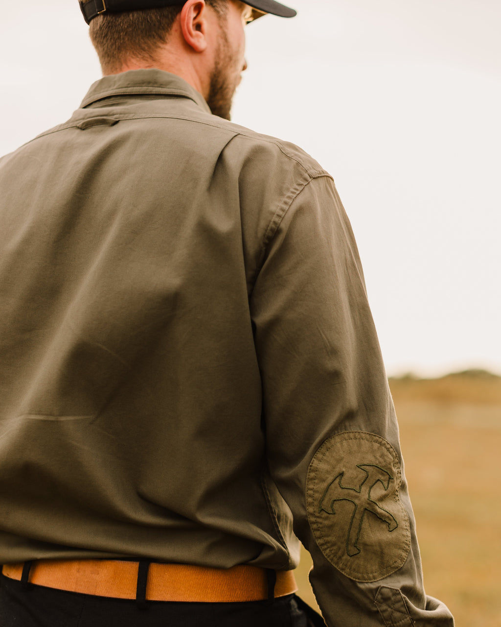 Back of the Ranger Green Jack Carr Hunters Shirt worn, showing the elbow patch