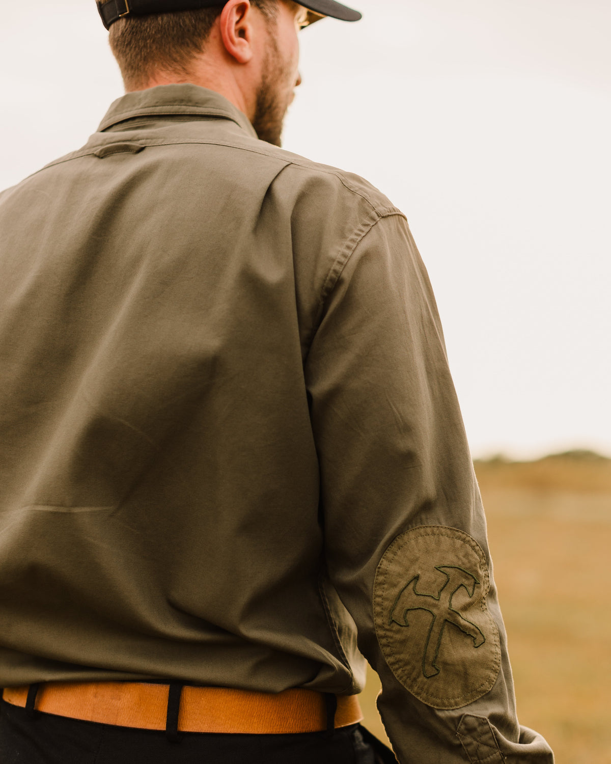 Back of the Ranger Green Jack Carr Hunters Shirt worn, showing the elbow patch