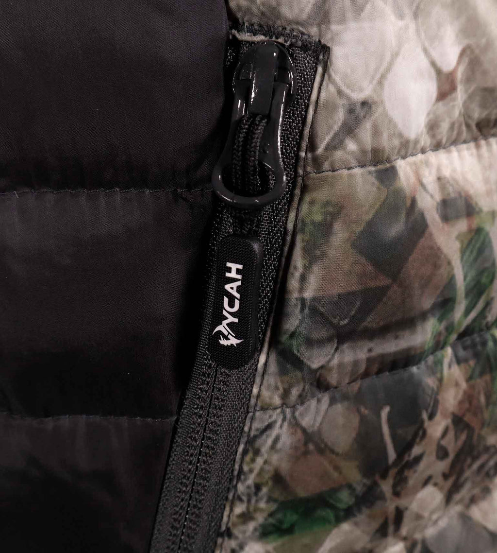 Close-up of a waterproof zipper against the black interior lining of the Cobalt Down Jacket