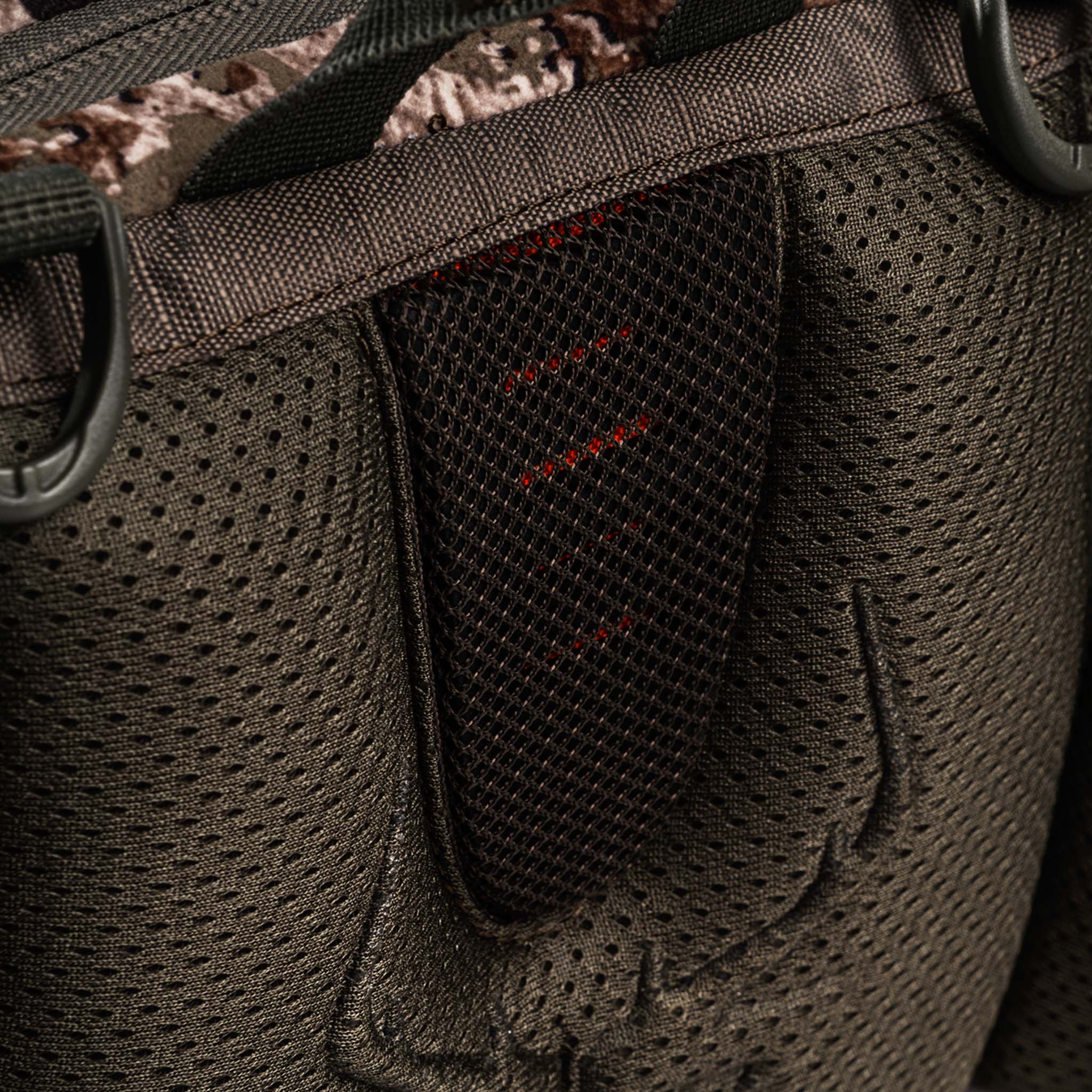 Camo hunting backpack with mesh side pockets and D-rings for outdoor gear storage