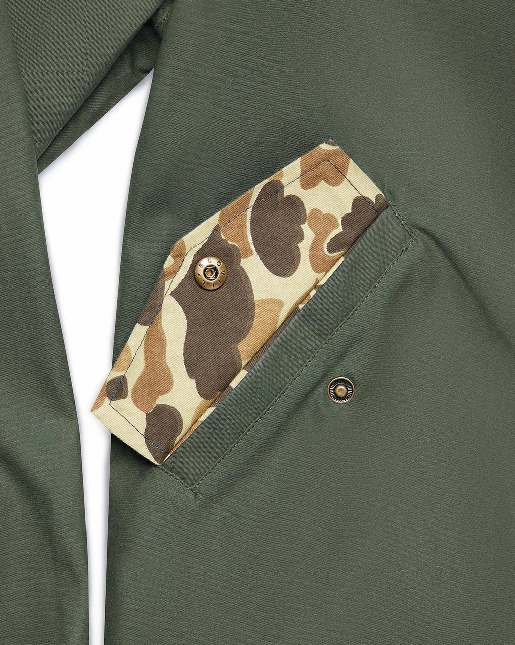 Original Camo lined pocket on the Sage Green Harrington Jacket