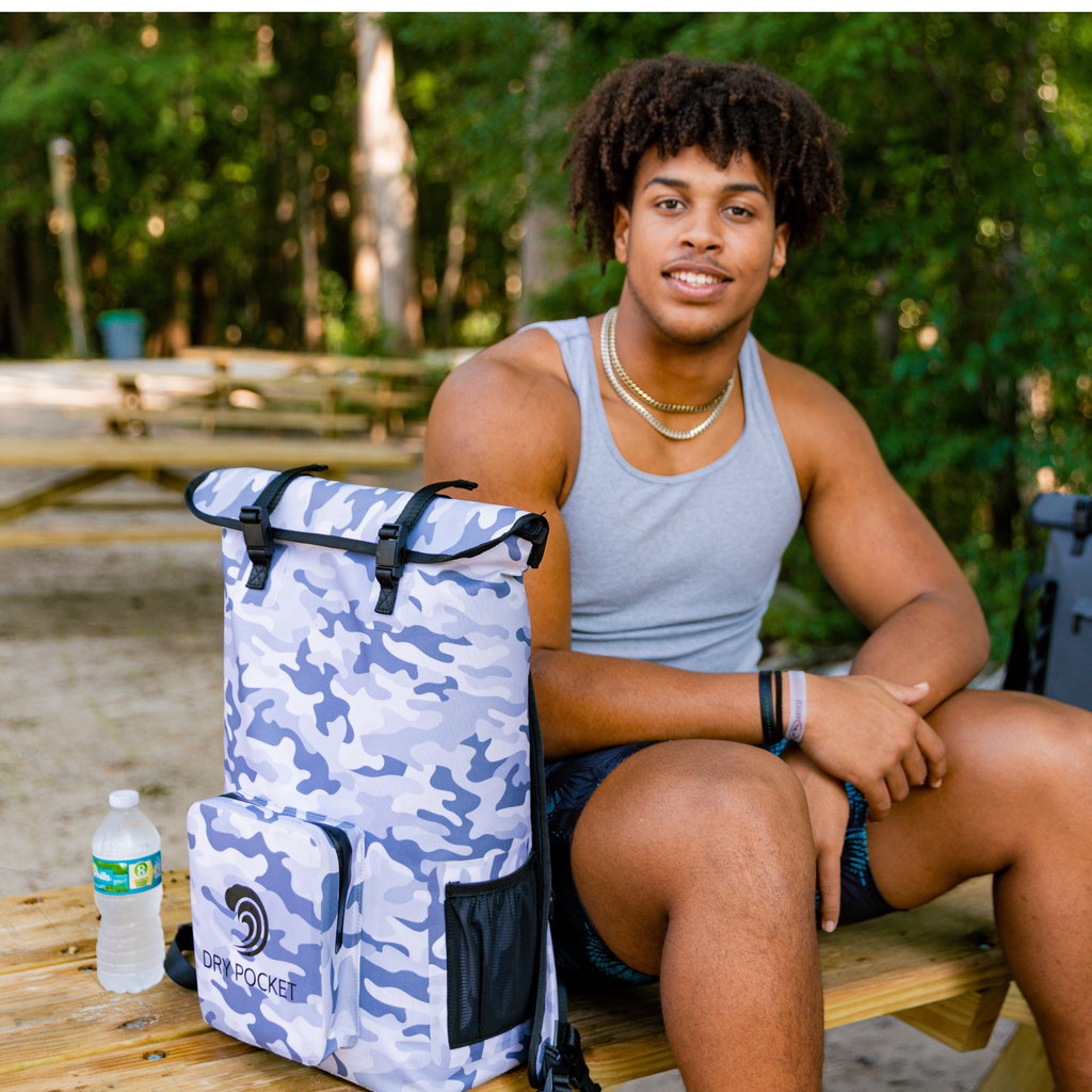 Blue and white camo dry bag with roll-top closure and dry pocket, ideal for outdoor adventures and hunting gear storage