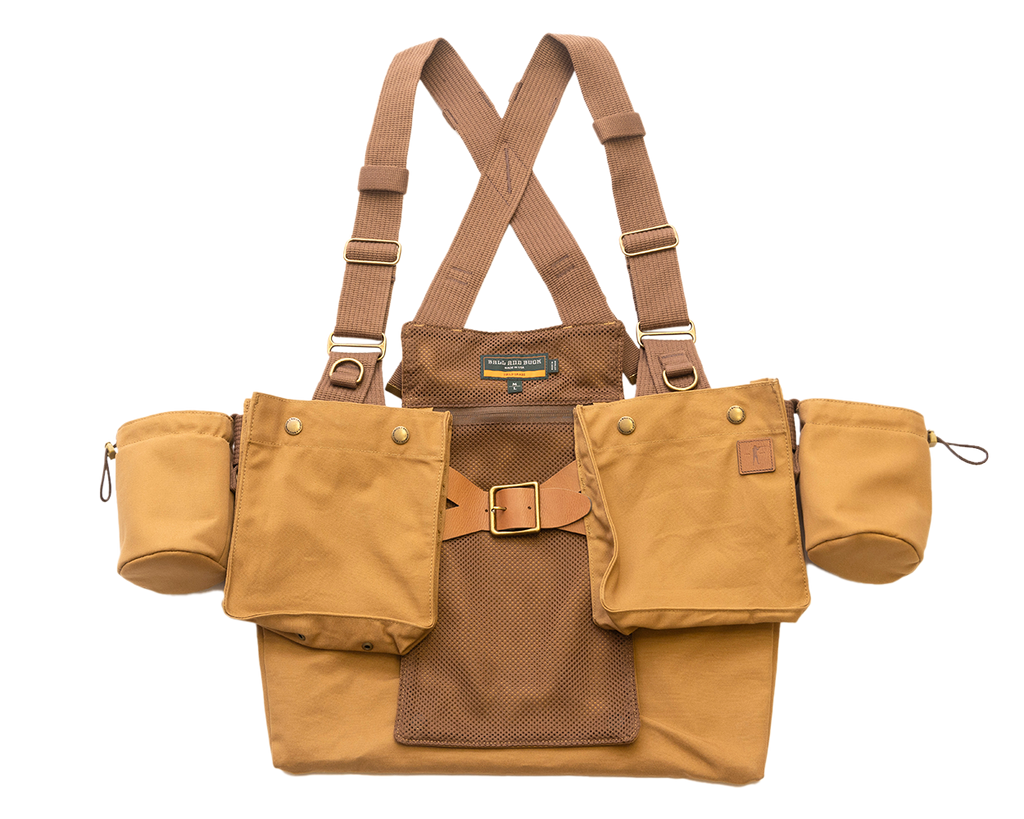 Ball and Buck Strap Vest in Signature Canvas, front view with brown webbing straps, shell pockets and cup holders