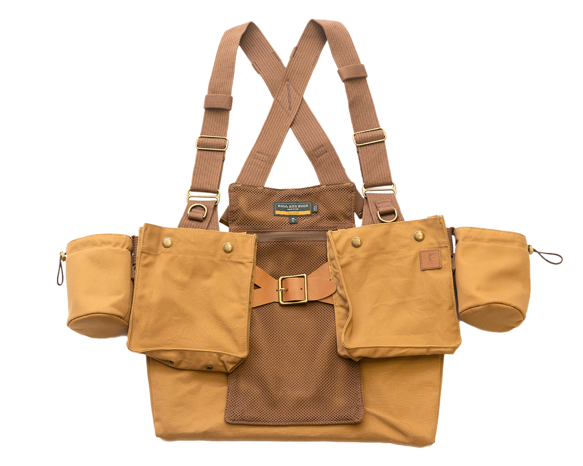 Ball and Buck Strap Vest in Signature Canvas, front view with brown webbing straps, shell pockets and cup holders