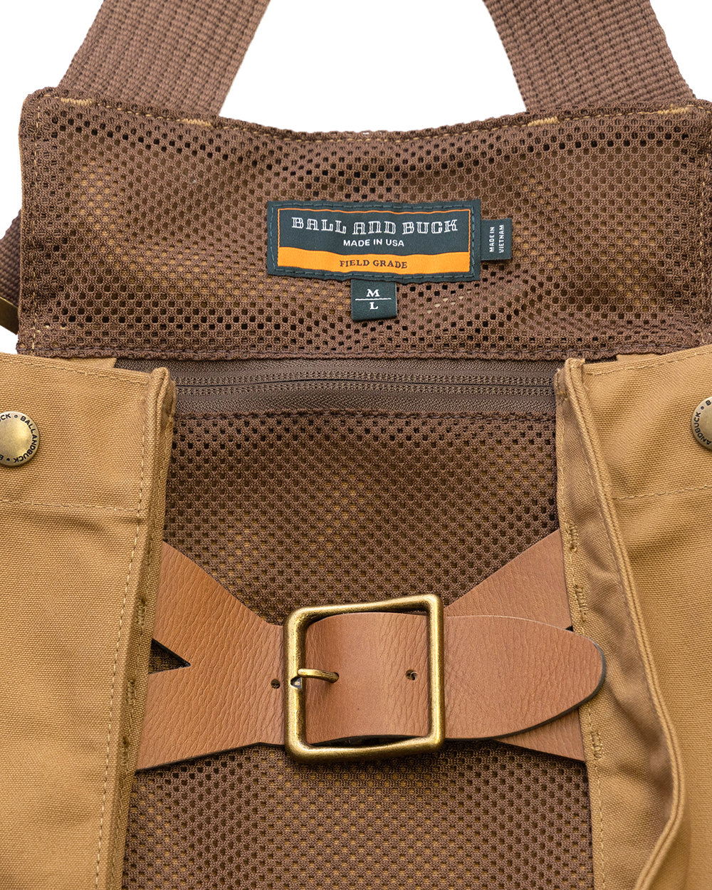 Mesh hydration sleeve and leather belt closure on the Signature Canvas Strap Vest