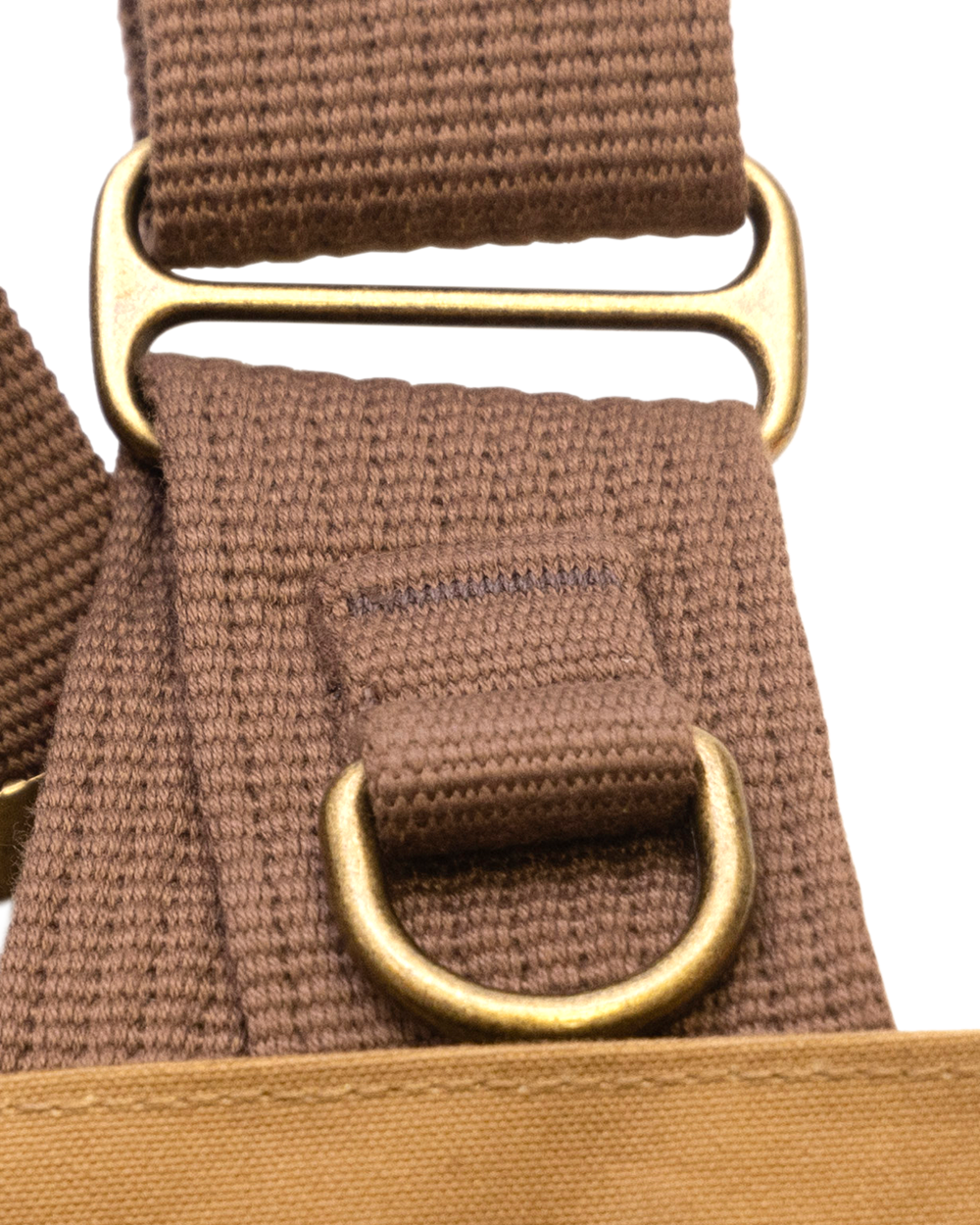 Brass slider and D-ring on the cotton webbing strap of the Strap Vest