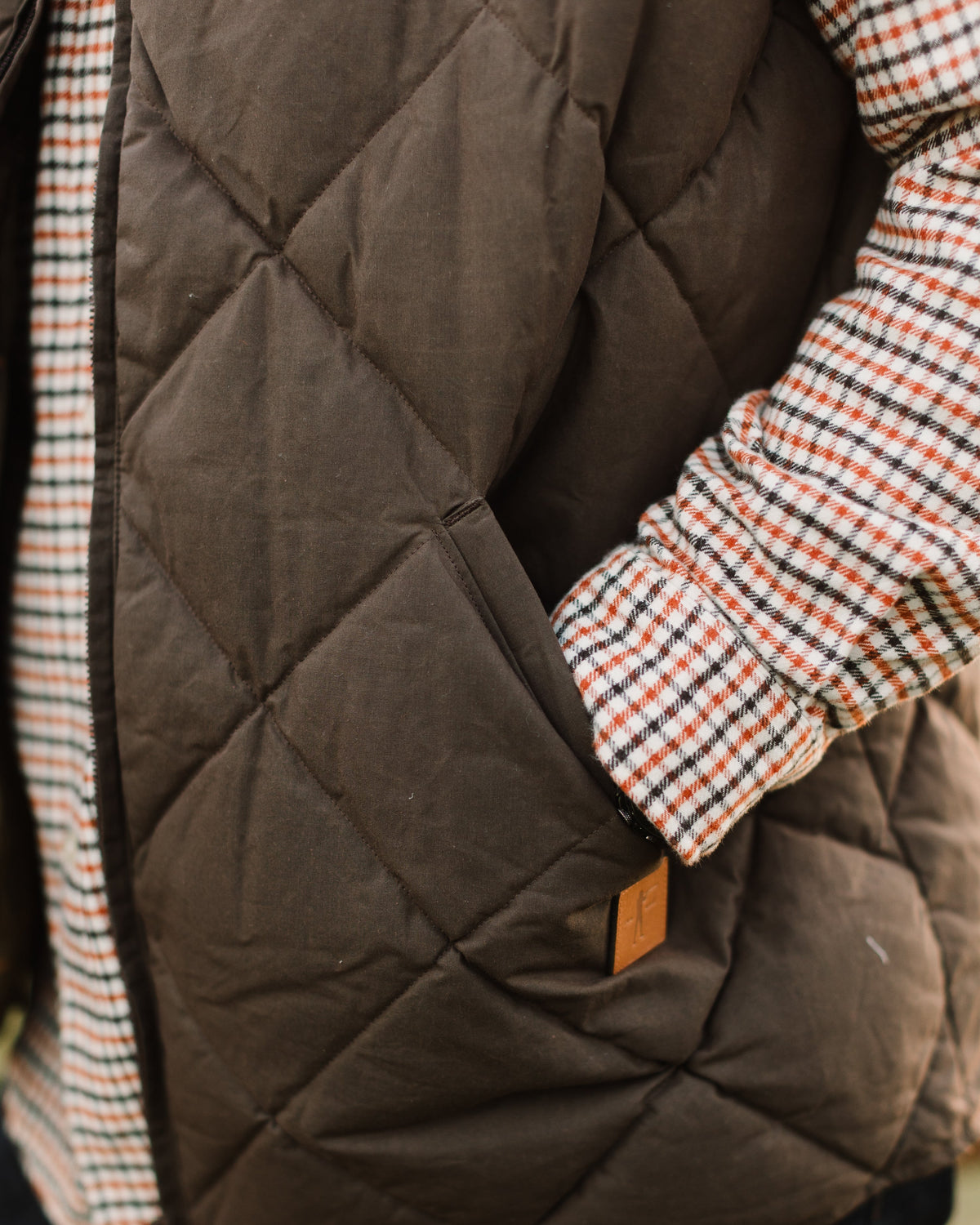 Hand warmer pocket on the Brown Arthur Quilted Waxed Down Vest