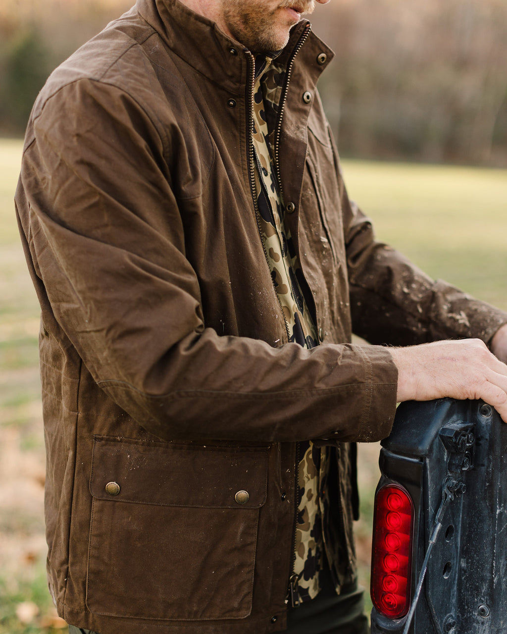 Oak Waxed Field Jacket worn outdoors, three-quarter view