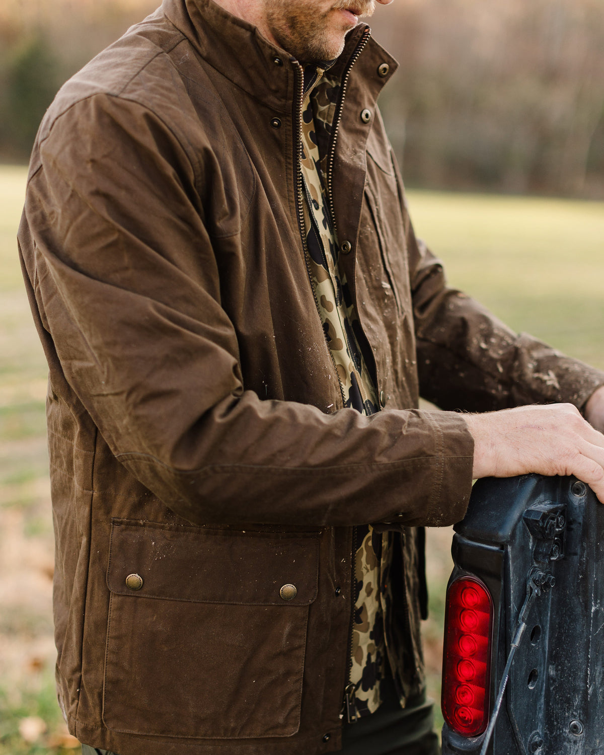 Oak Waxed Field Jacket worn outdoors, three-quarter view